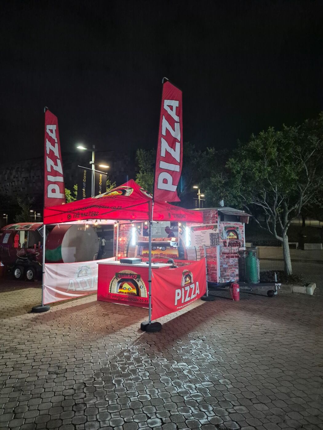 Pronto Pizza lit up at an evening function