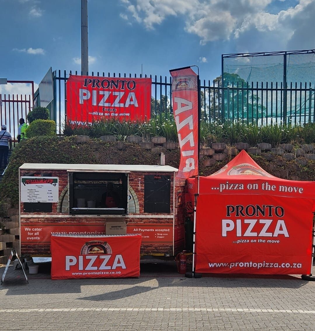 Pronto Pizza branded banners at a market