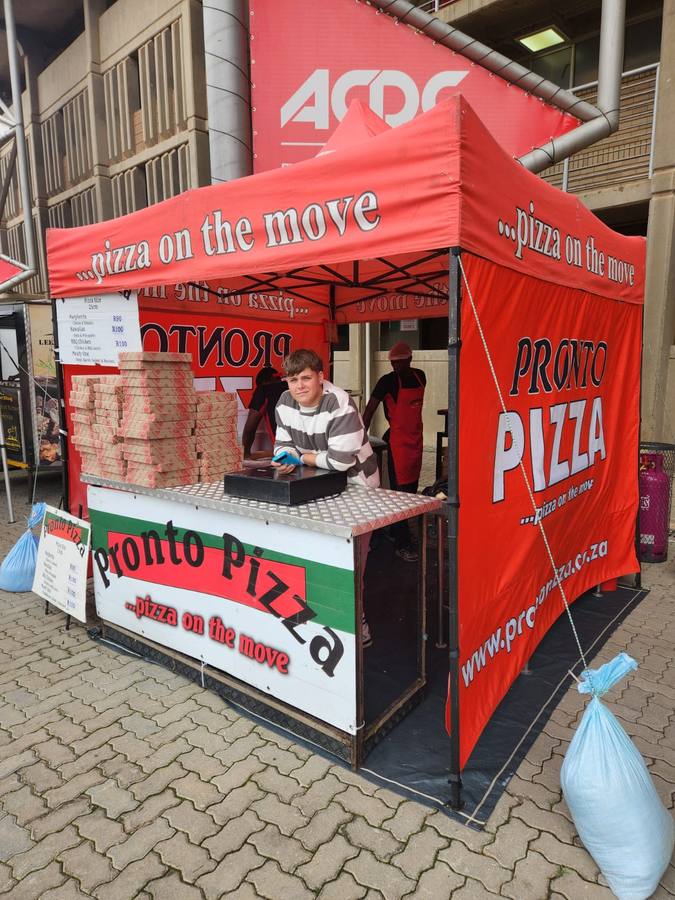 Pronto Pizza serving at a festival