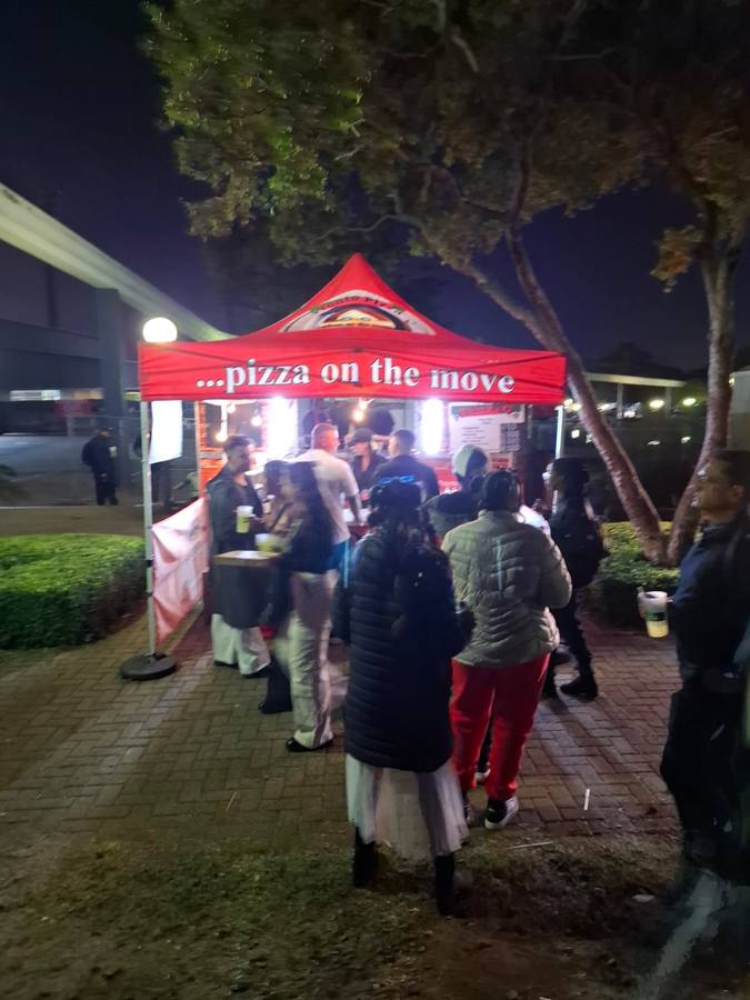 Pronto Pizza serving at a festival
