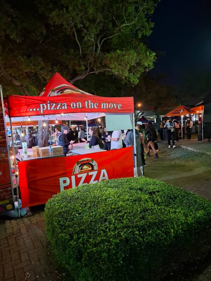Pronto Pizza serving at a festival