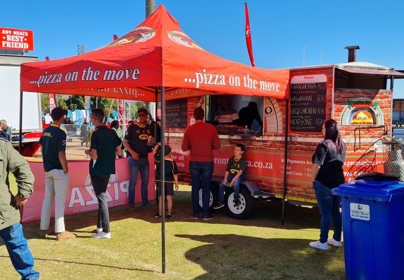 Pronto Pizza stall serving a busy crowd